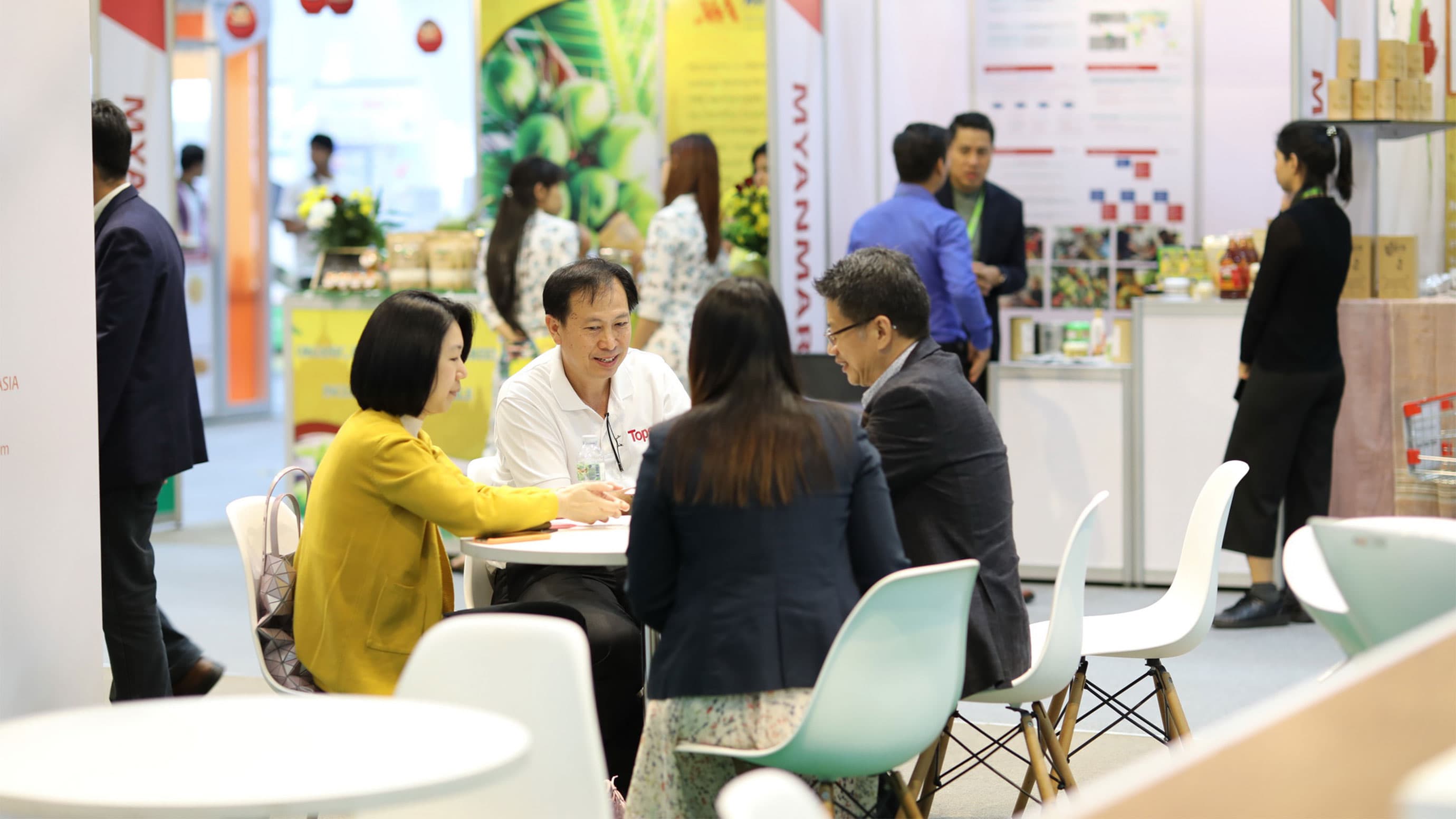 Business conversation with four people at a table