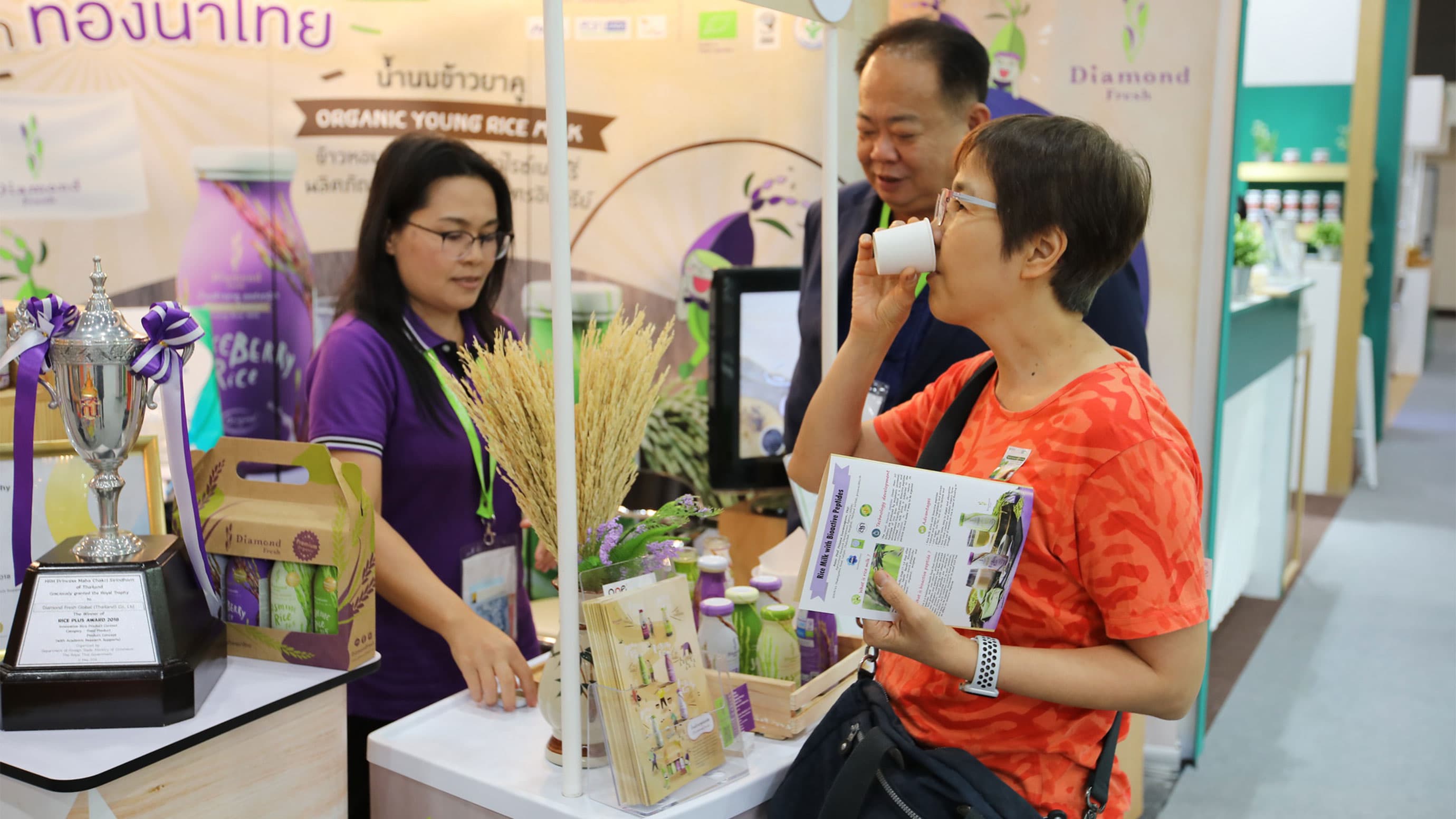 Visitors tasting products